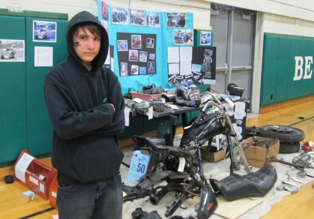 Ogdensbrg student David Hall is shown with his motorcycle project.