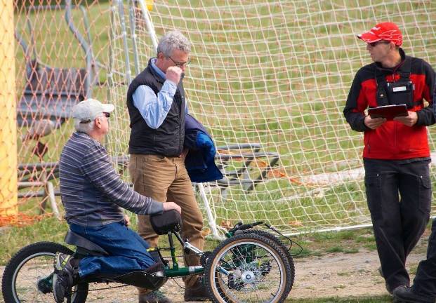 John Swartwood, PSIA Adaptive ski examiner and advisory committee member, gives last-minute instructions to Chuck Wallace, a Mountain Creek ski patroler.