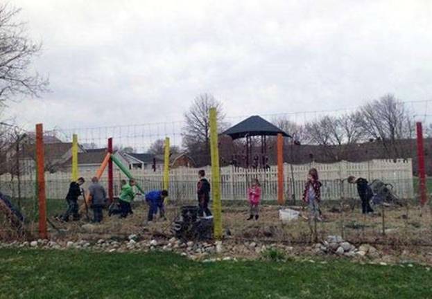 Children from Rainbows of Learning, a child care center in Augusta, take an early look at the garden that will be brought to life there this summer through the Starting Healthy Initiative.