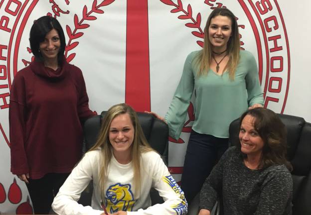High Point's Cassidy Preste, seated left, signs her Letter of Intent to continue her swim career at Misericordia University. Pictured are her mother, Audra, seated right. In the back row from left to right are assistant coach Jaclyn Bambera and head coach Kate Niemiera.