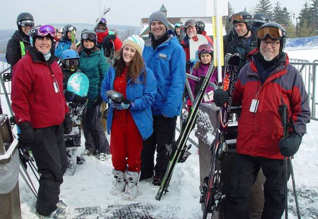 Skiers wait for Lift Operator Laurie form Vernon to open the Cabriolet lift at Mountain Creek.