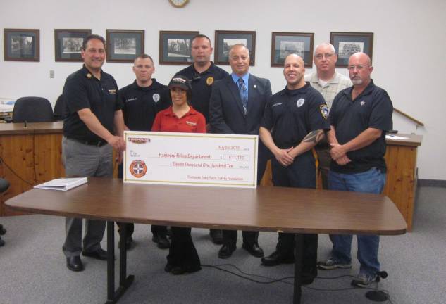 On May 26, the Firehouse Subs Foundation presented a check for $11,110 to the Hamburg police for the purchase of new portable police radios. Pictured are members of Firehouse Subs, members of the Hamburg Police, Mayor Paul Marino, Councilman Dan Barr, Director Wayne Yahm and Assemblyman Parker Space.