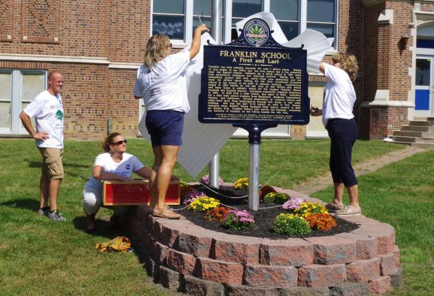 As the official Sussex County plaque recognizing the Franklin School was unveiled, doves were released to fly above the crowds.