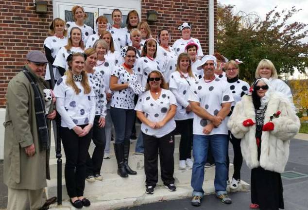 Showing unity for the holiday, the staff of Hamburg School dressed up as 101 Dalmaitions, Jasper (Mr. Jinks, CSA) and Cruella DeVille (Mrs. Kartanos, VP).