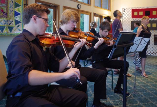 Three members of the Vernon Township High School Chamber Orchestra entertained the artists and patrons at the Highland Lakes annual community art show.