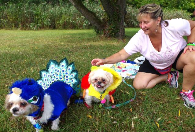 Doing it for the critters West Milford resident Kimberly Lehman and her dogs Kristy and Kelly prepared for and then competed in the costume contest near the beach in Wawayanda State Park.