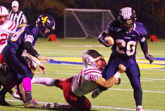 Jefferson ball carrier Connor Brown is in the grasp of Morris Hills defender Damian Gonzalez.