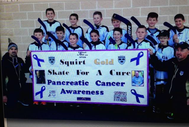 Local hockey team 'skates it forward' November: Pancreatic Cancer Awareness - $500 was donated to the Lustgarten Foundation