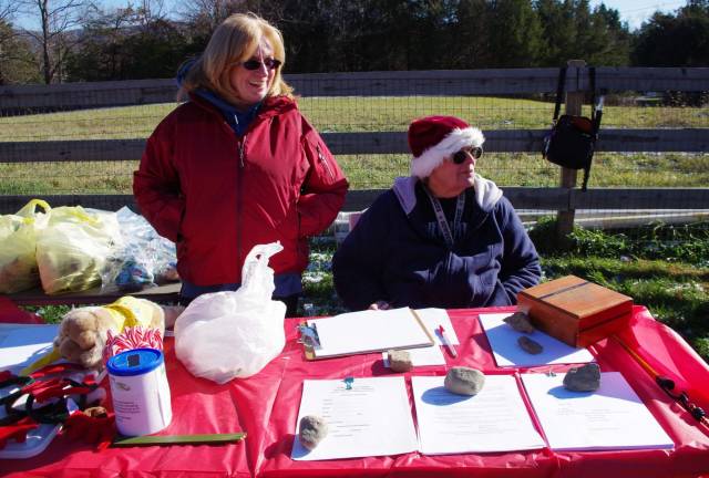 Long-time DOGS of Vernon volunteers Pat Lang, left, and Barbara Green offered treats for the pups and the people.