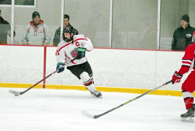 High Point-Wallkill Valley's Ryan Nuzzo steers the puck. .