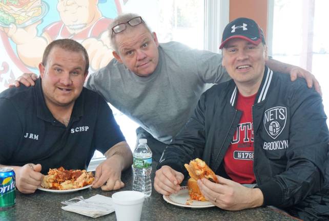 From left, Josh Mackerley, Kenny Devoe, and Steve Schels enjoy community at Kenny's Corner.