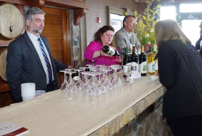 Foodies and wine connoisseurs converge in Hardyston Mark Cacace of Wantage's Ventimiglia Vineyard listens to questions by a visitor interested in the vineyard and its fine wines. The winery's offerings seemed to be very much appreciated, especially their sweet white wine.