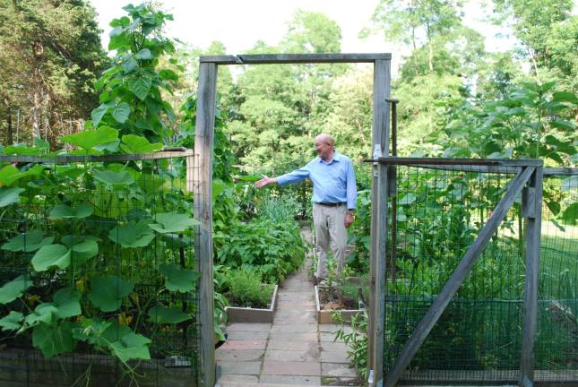 Gardener Klass Vogel welcoming attendees to his bountiful veggie patch.