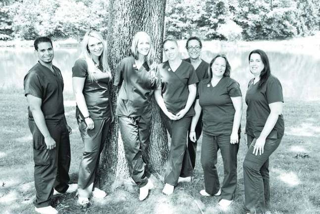 The graduates are (from left to right): Stephen Calderon, Sarah Squillante, Rachel Ackerman, Ashley Rauch, Franca Biondolillo, Natalie Decker, and Jamie Medeiros-Batty.