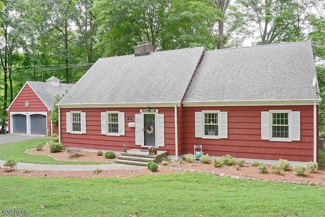 Four-bedroom colonial is nestled in a parklike setting