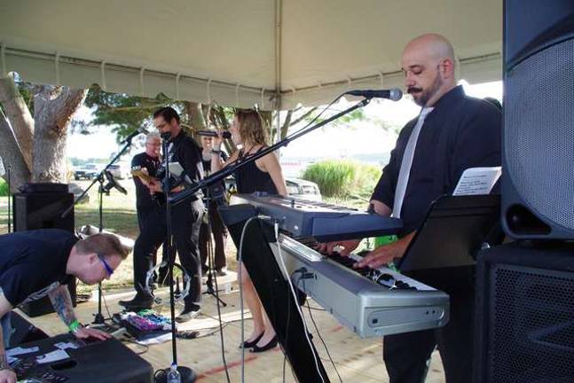 About 700 turnout for Cava Winery event “The Uptown Getdowns” are shown performing at the Cava Winery and Vineyard. Their musical offerings include a diverse mix of music spanning a wide spectrum of genres from bossa nova, rock, jazz and everything in-between.
