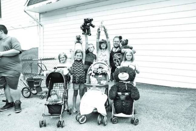 Space Farms holds Teddy Bear Day Zoey, Shane, Davin, Abby, Kaitlyn, Stephanie and Kendra of Ogdensburg came with bears of all sizes to Space Farms Teddy Bear Day on Saturday.