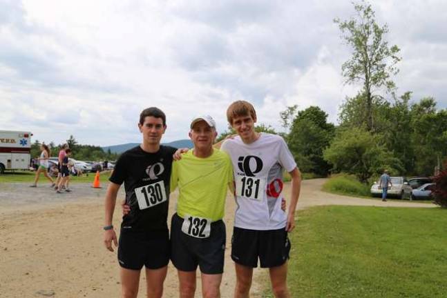 A family of runners. From left: Brother Jeremy Scheid, father Larry and Justin before a race.