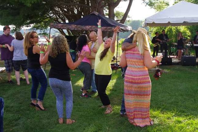 About 700 turnout for Cava Winery event Dancing to the music of the “The Uptown Getdowns.”