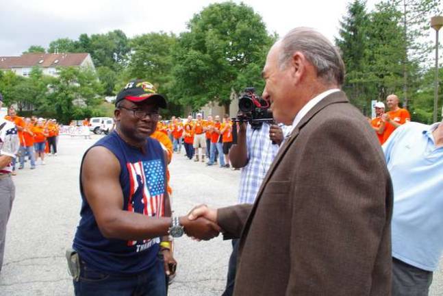 Hamburg veteran George Alapka, left, is greeted by fellow army veteran Freeholder Director Richie Vohden at last Thursday&#x2019;s unveiling of Alapka&#x2019;s refurbished condominium unit.