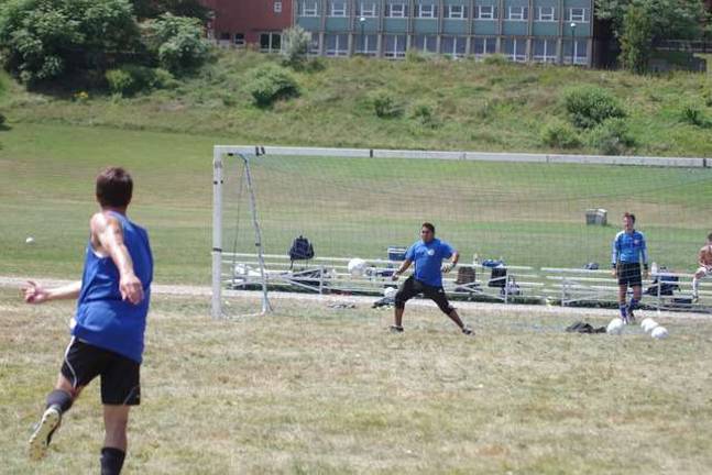 College soccer team prepares for season Skylanders assistant coach Auggie Casas plays goalie as the ball moves towards him. Casas is from Peru.