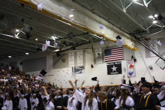 Time to celebrate No graduation ceremony is complete without the traditional throwing of the mortar boards.