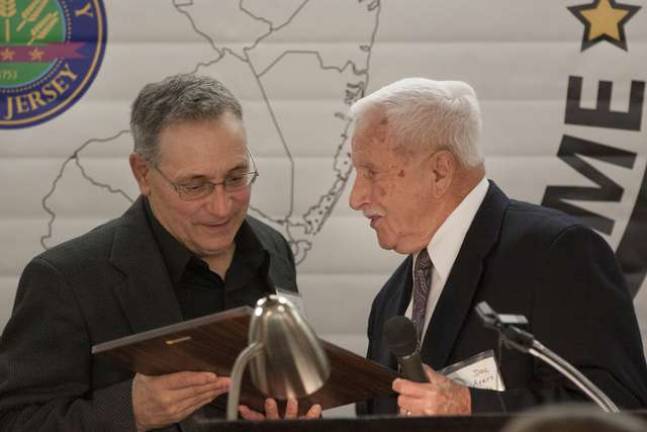 Louis Frato accepts his plaque from Dolson &quot;Doc&quot; Ayers during the induction dinner into the Sussex County Sports Hall of Fame Class of 2014.