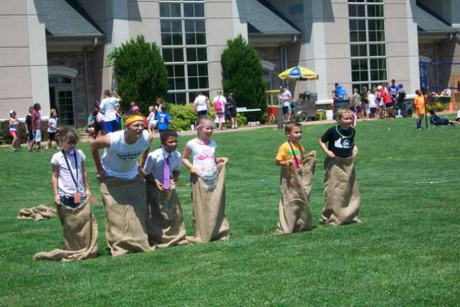 The old-fashioned potato sack race was a hit at the Breakaway Camp Carnival.