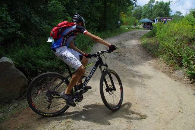 PHOTO BY CHRIS WYMAN Team Bulldog racer Chris Compton of Califon/Glen Gardner is shown coming up out of the Rock Garden and heading toward the finish line. It was only his third attempt at racing but he managed to place first in the Category 3 Junior Men&#xed;s Division in the 15-18 age group.