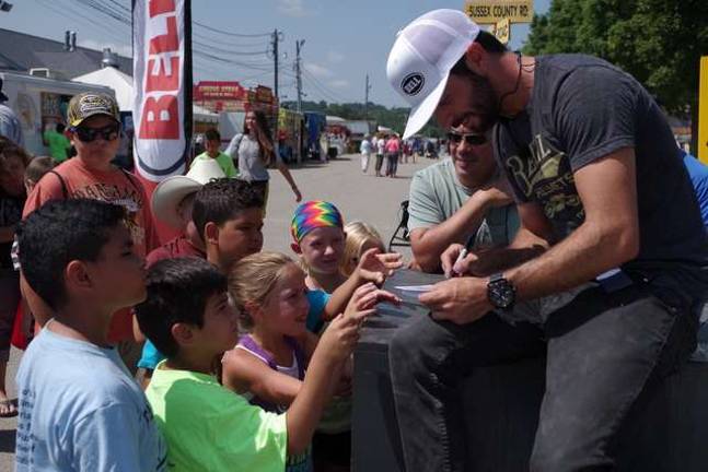 Hype on a Bike Clark meets with young fans.