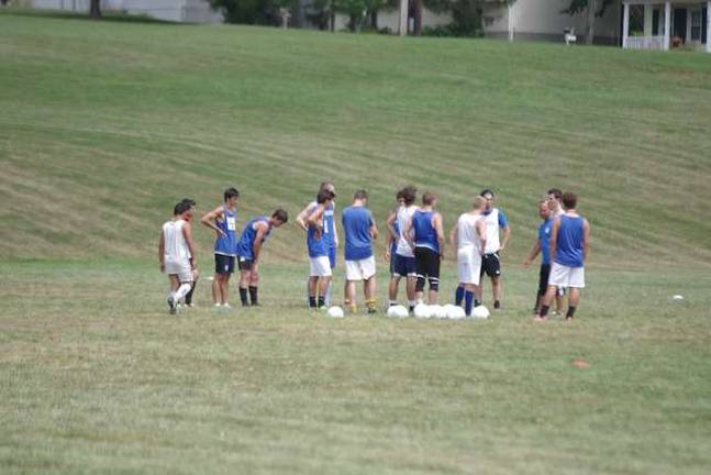 College soccer team prepares for season The Skylanders huddle.