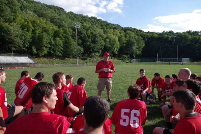 High Point Regional High School varsity football head coach Jim Delaney talks to players.