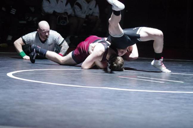 Pompton Lakes defeats Wallkill Valley A wrestling referee watches the action on the mat.