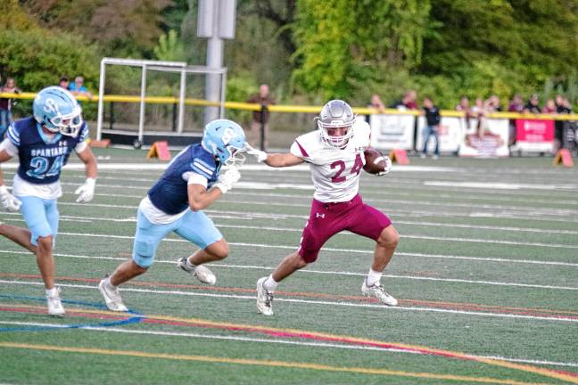 High Point remains undefeated <b>Newton ball carrier Evan Cotter puts a stiff-arm on a Sparta defender. He made one touchdown, rushed for 91 yards and caught three passes for 137 yards.</b>