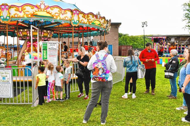 Photos: Firemen’s Carnival Children check to see if they are tall enough for a ride Friday, May 30 at the Firemen’s Carnival in Oak Ridge.