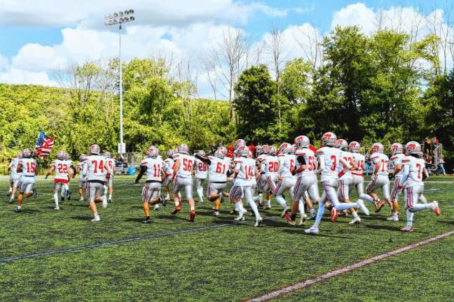 Football roundup: High Point beats Jefferson <b>The High Point Wildcats run onto the field. </b>(Photo by Maria Kovic)