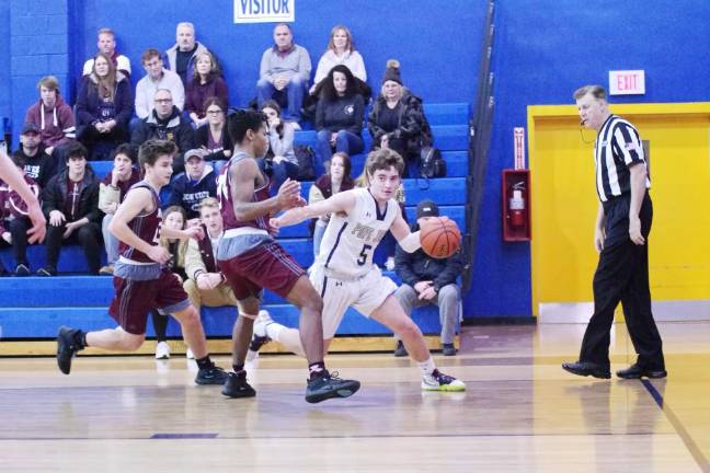 Pope John's Sean O'Boyle moves the ball on the court in the first quarter.