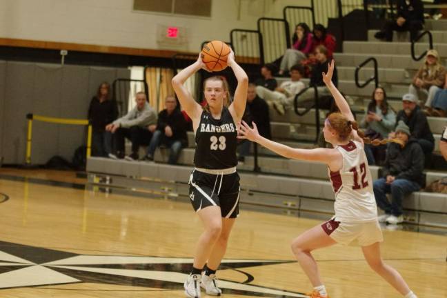 Wallkill Valley's Jackie Schels looks to pass the ball while being covered by Newton's Avery Eigner.