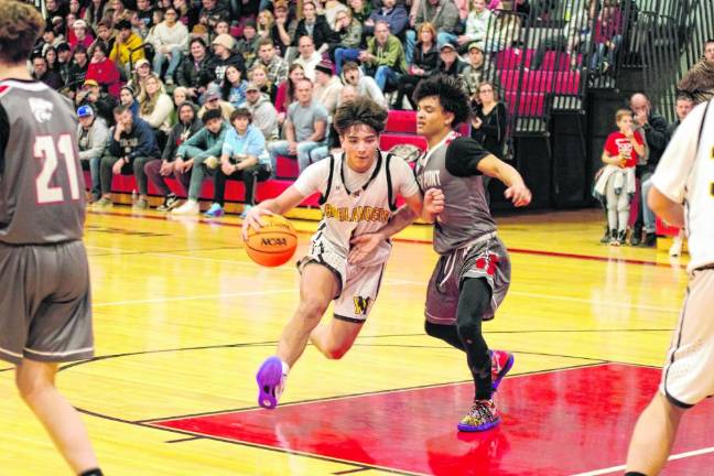 West Milford's Tyler Liguori dribbles the ball while covered by High Point's Jacob Guinta. Liquori scored 10 points.