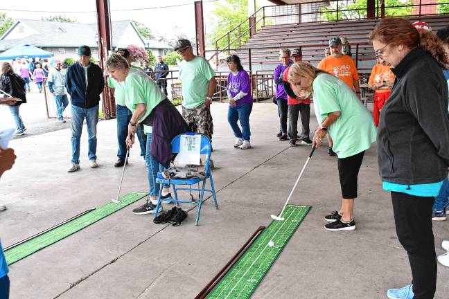 Montague wins gold in Senior Olympics <b>Participants compete in Golf Putt at the Sussex County Senior Olympics on June 17 at the fairgrounds in Augusta. (Photos by Maria Kovic)</b>