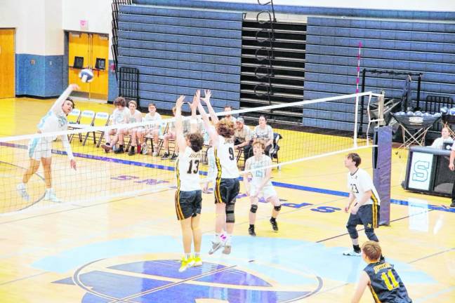 At left Sparta's Joshua Tolentino strikes the ball toward the Jefferson side of the net.