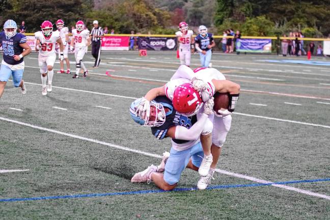 Football roundup: Vernon shuts out Dover <b>A Lakeland ball carrier is tackled by a Sparta defender.</b>