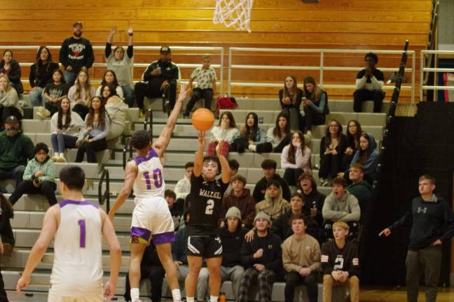 WV2 Wallkill Valley's Dylan Klackowski (2) attempts a shot from long range in the second half. He scored 10 points in the game against Warwick Valley.