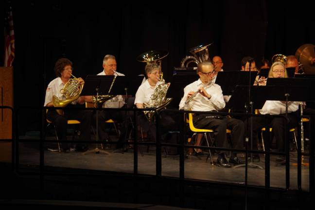 Part of the woodwind section is shown with the brass section of the Oakland-based North Jersey Concert Band during Sunday&#xed;s free concert.