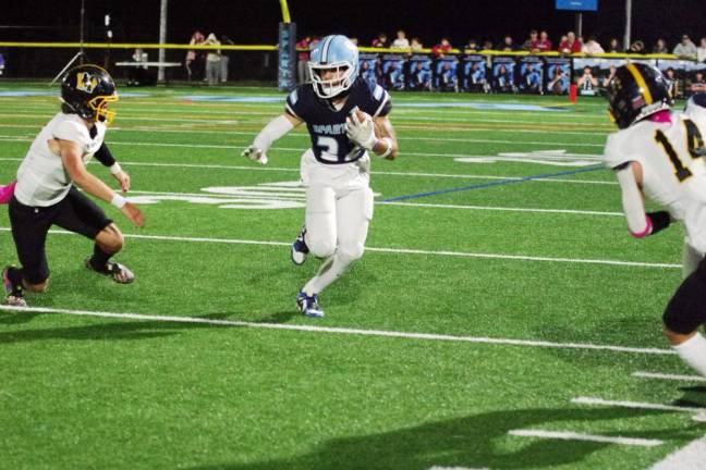 Sparta running back Josh Brancy maneuvers the ball between West Milford defenders Friday, Oct. 13. Brancy scored three touchdowns in the 41-20 win. (Photos by George Leroy Hunter)