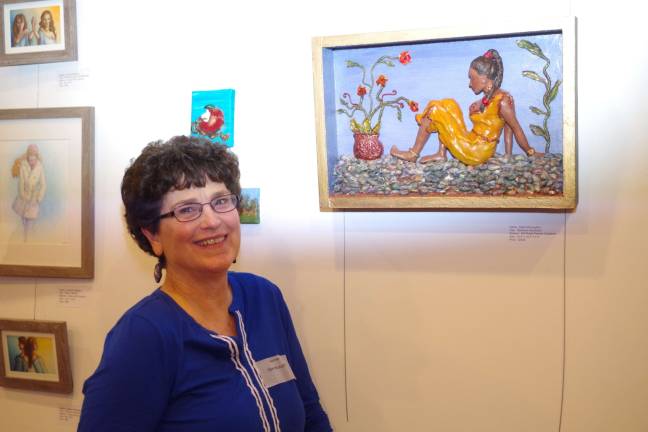 Dawn McLaughlin of Highland Lakes is shown with her mid-relief painted sculpture Serena&#xfe;&#xc4;&#xf4;s Sanctuary at the Skylands Gallery &amp; Studio in Wantage.