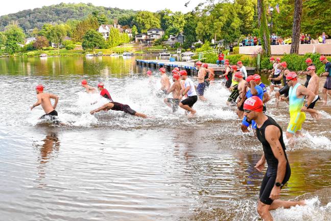 Photos: Pass it Along’s 14th annual Triathlon Pass it Along’s 14th annual Triathlon begins with the swim course Saturday, July 26 in Lake Mohawk in Sparta. More than 200 people of all ages and experience levels participated. (Photos by Maria Kovic)
