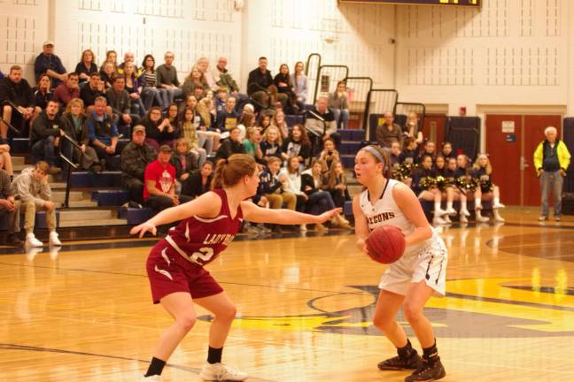 Jeffereson's Taylor Langan dribbles the ball while covered by Newton's Emily Pappas. Langan scored 22 points.