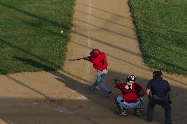 High Point Knights rout Outlaws High Point's Kyle Adams hits the ball.