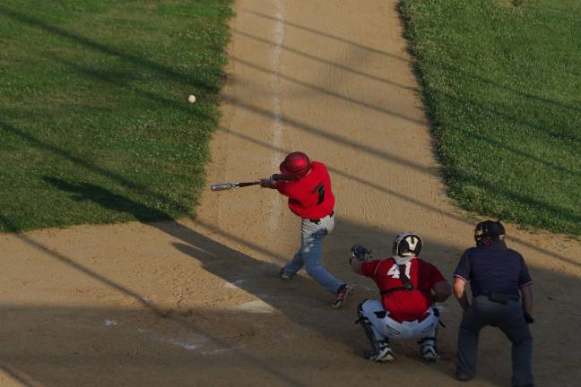 High Point's Kyle Adams hits the ball.